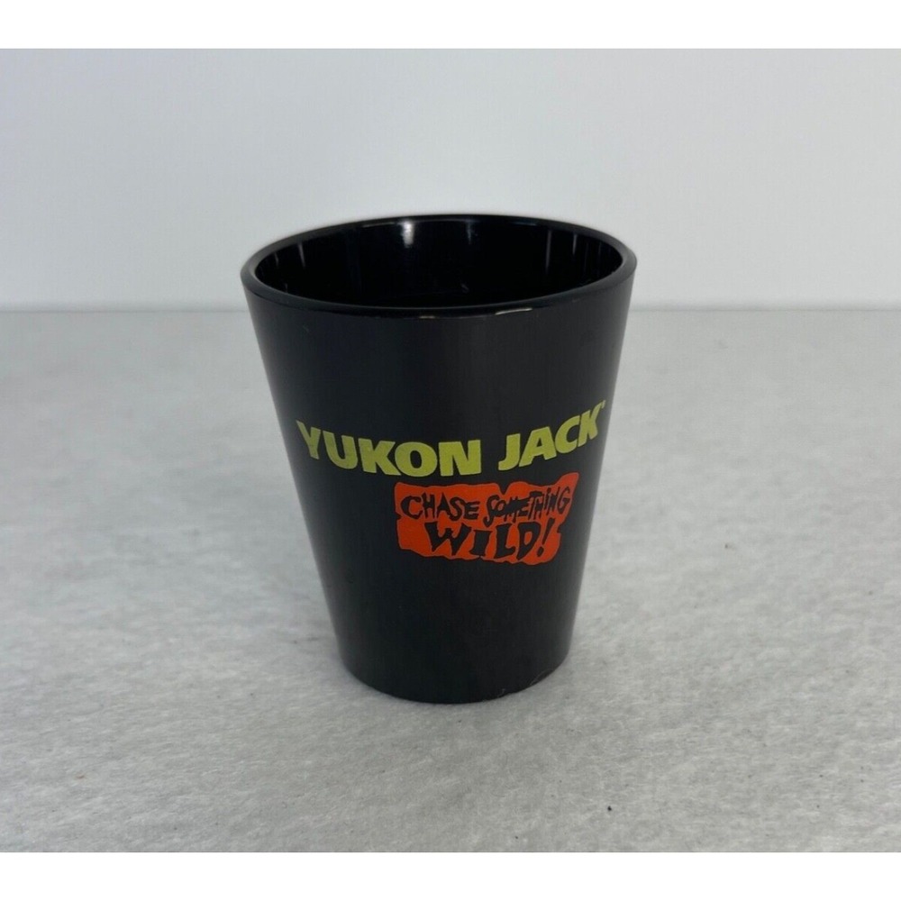 Yukon Jack Novelty Plastic Shot Glass Chase Something Wild Black Red
